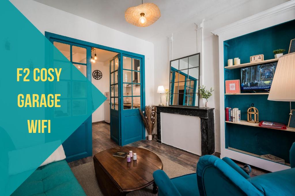 a living room with a blue accent wall at "Le 44", immeuble de 2 logements neufs, garage pour le F2 uniquement in Perpignan