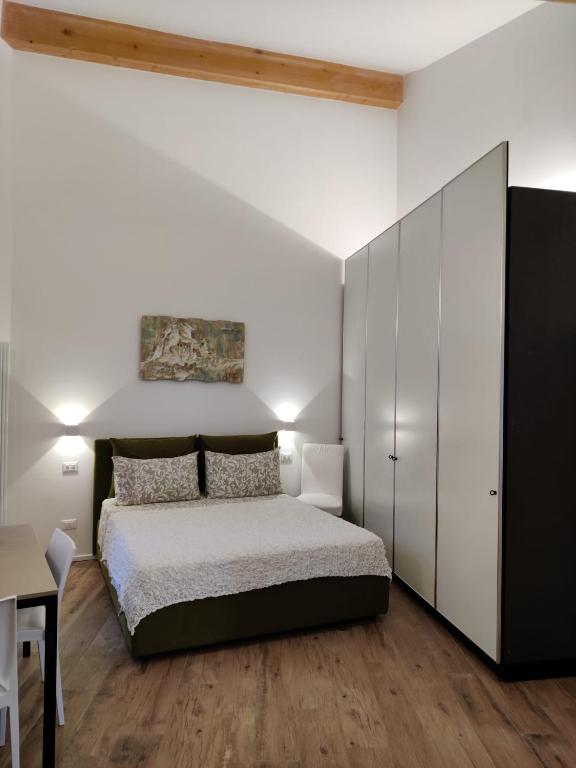 Postel nebo postele na pokoji v ubytování River Inn Arco