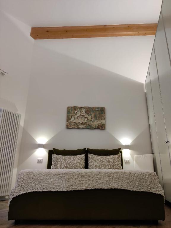Postel nebo postele na pokoji v ubytování River Inn Arco