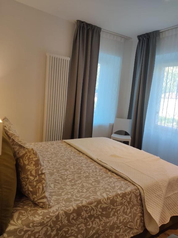 Postel nebo postele na pokoji v ubytování River Inn Arco