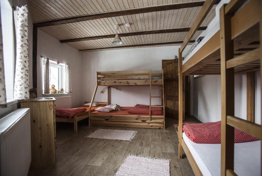 Postel nebo postele na pokoji v ubytování Ve Stodole
