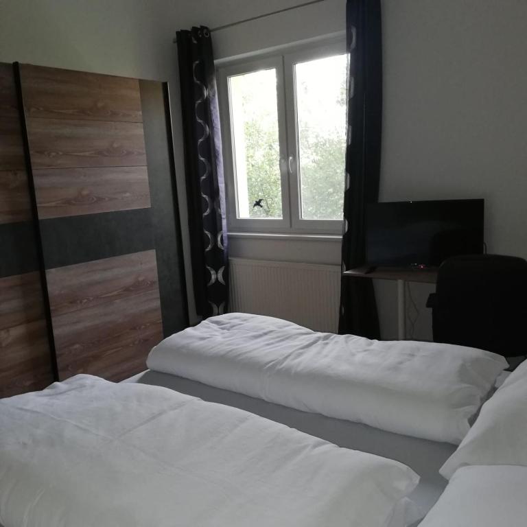 Postel nebo postele na pokoji v ubytování Rezident consult s.r.o.