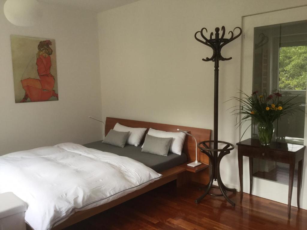 a bedroom with a bed and a vase of flowers at Haus Loretz in Lasa