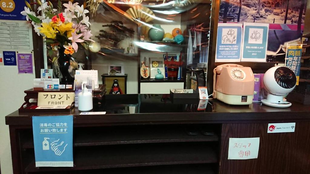a counter in a hair salon with a hair dryer at Takigawa Ryokan in Kyoto