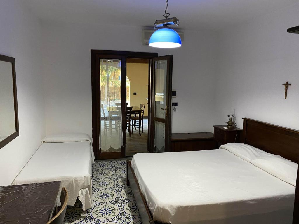 Postel nebo postele na pokoji v ubytování Hotel Al Togo Fitness & Relax