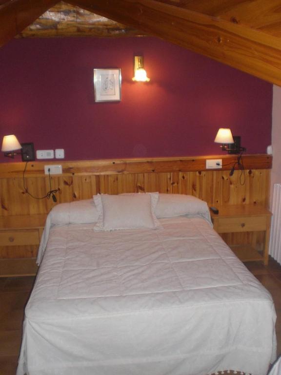 Postel nebo postele na pokoji v ubytování Roch Hotel
