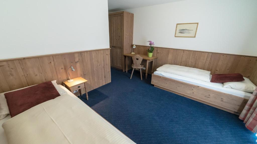Postel nebo postele na pokoji v ubytování Hotel Lutter