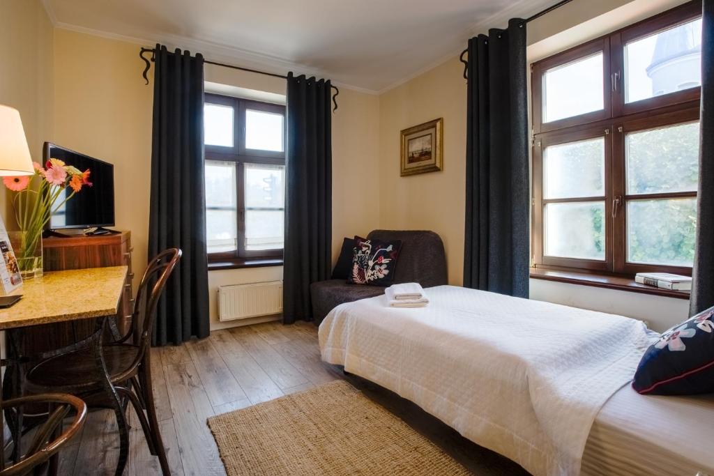 Postel nebo postele na pokoji v ubytování Oliwa Park Residence