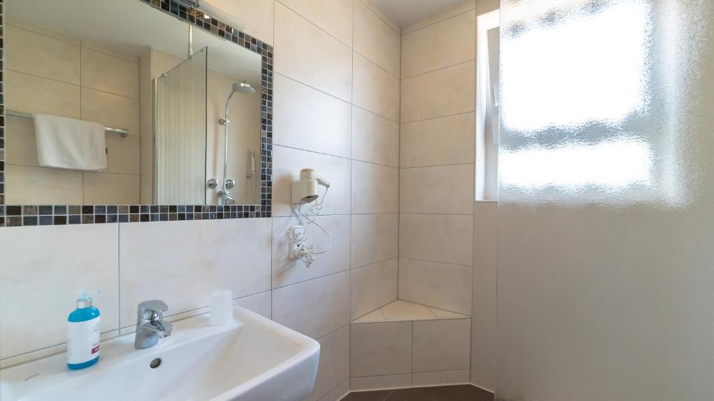 Koupelna v ubytování Hotel Lutter