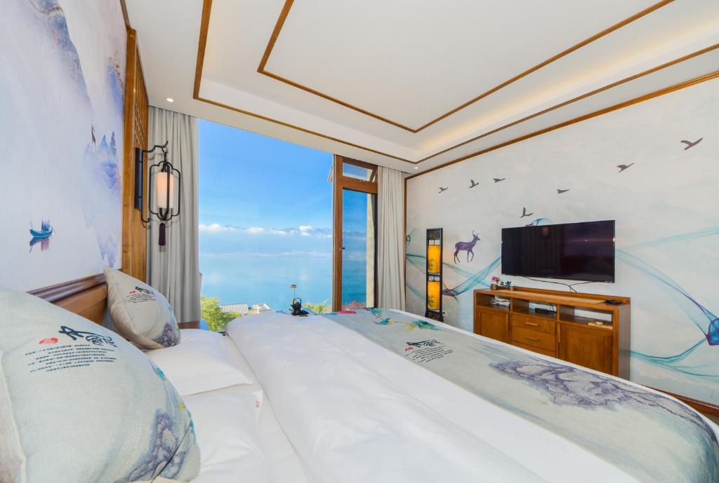 Postel nebo postele na pokoji v ubytování Dali Dare Sea View Gueshouse
