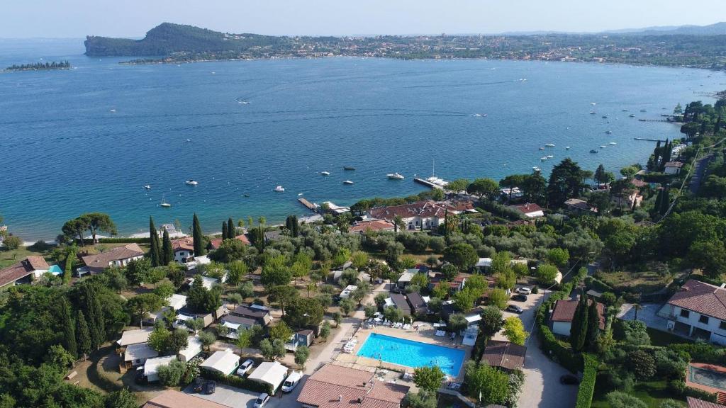 an aerial view of a town with a body of water at Vacanze Glamping Boutique in San Felice del Benaco