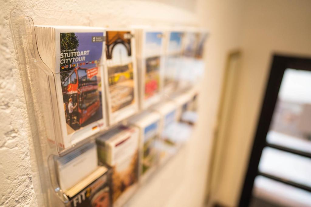 a close up of a wall with posters on it at Pension am Heusteig in Stuttgart