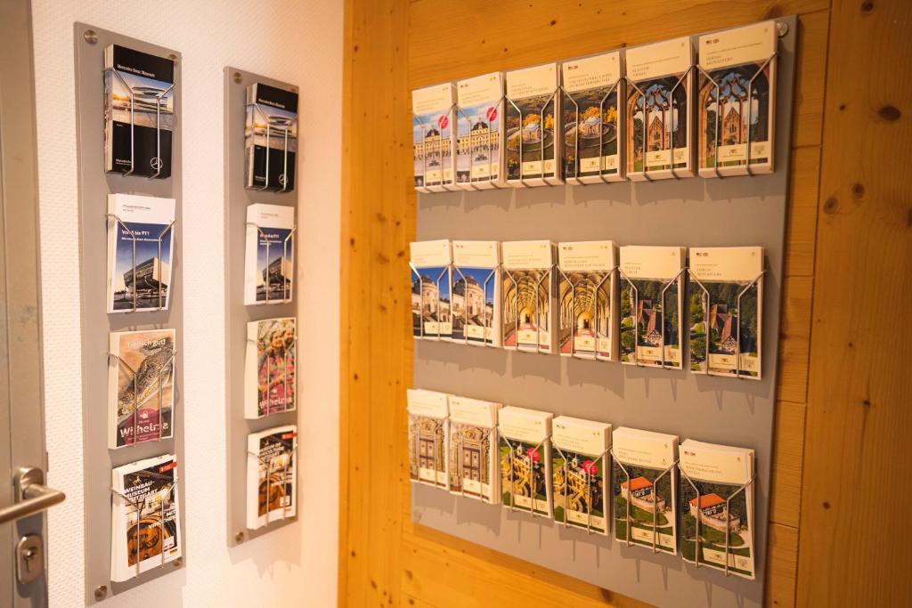 a room with a door and some pictures on the wall at Pension am Heusteig in Stuttgart