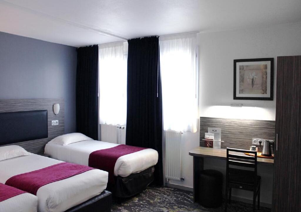 Postel nebo postele na pokoji v ubytování The Originals City Hôtel, Aéroport Beauvais