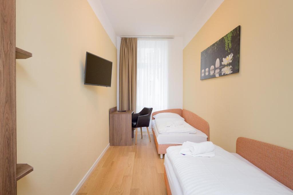 TV a/nebo společenská místnost v ubytování Vienna Stay Apartments or Rooms 1050