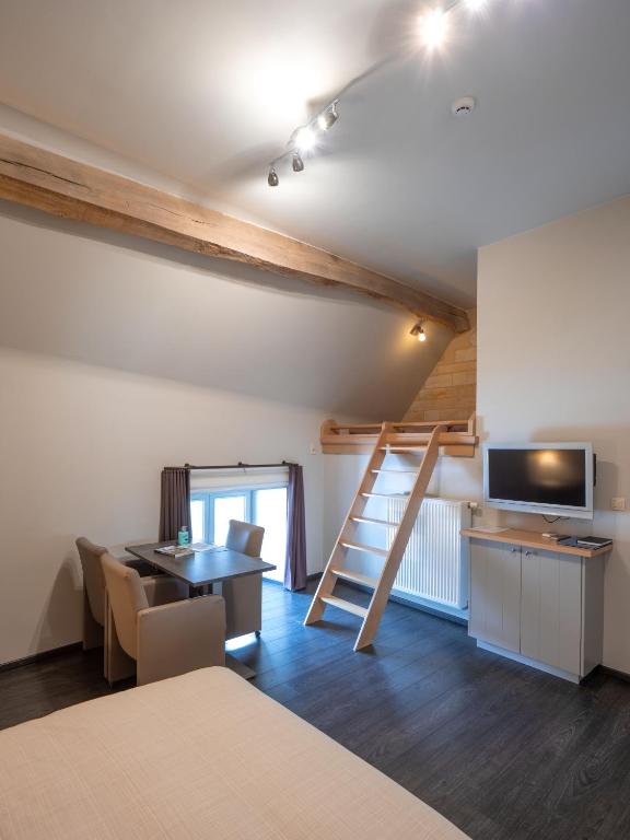 Postel nebo postele na pokoji v ubytování B&B De Oude Winning