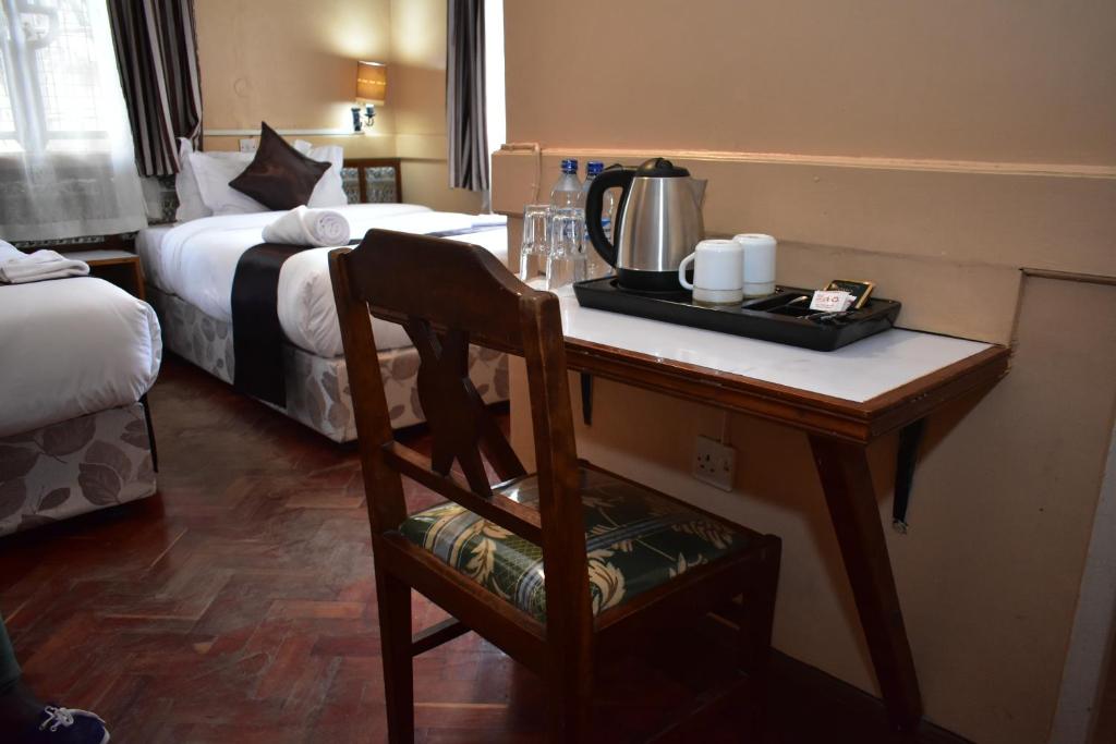 Postel nebo postele na pokoji v ubytování Impala Hotel Parklands