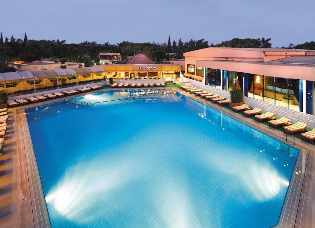 an overhead view of a large swimming pool at a hotel at Cairo Pyramids Hotel in Cairo