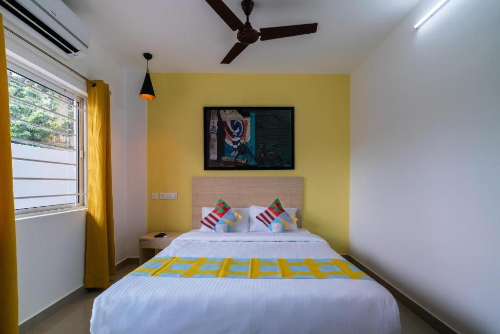 Postel nebo postele na pokoji v ubytování Flamingo Suites