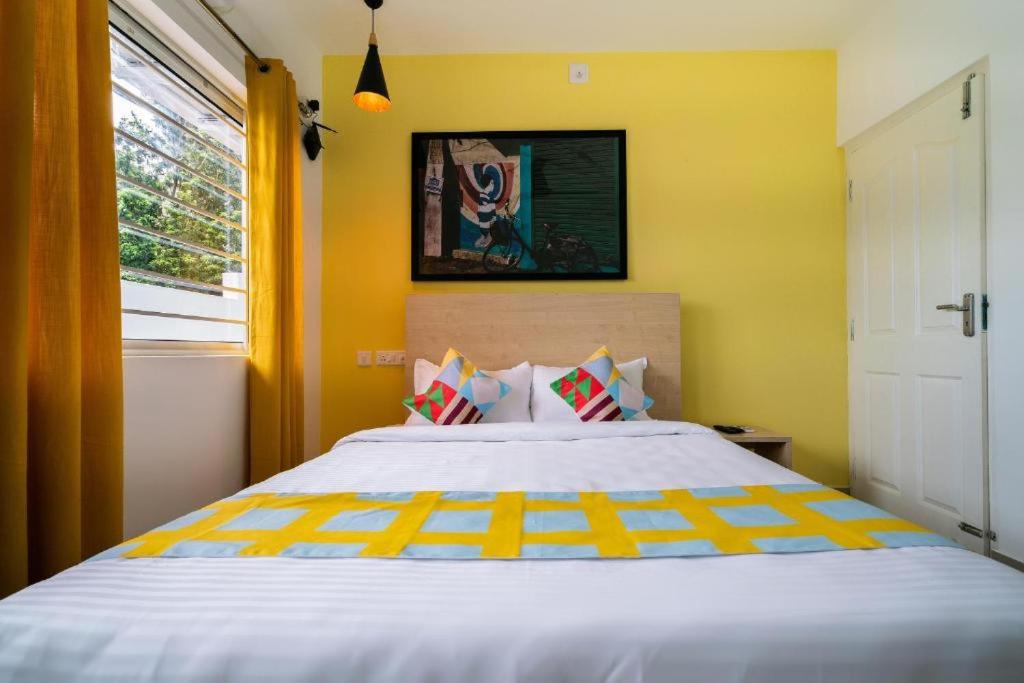 Postel nebo postele na pokoji v ubytování Flamingo Suites