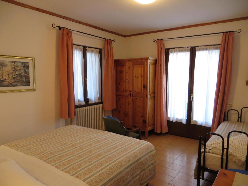 Posteľ alebo postele v izbe v ubytovaní Hotel Piccolo Mondo