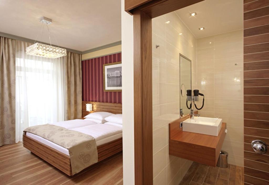 Postel nebo postele na pokoji v ubytování Hotel Vienna beim Prater