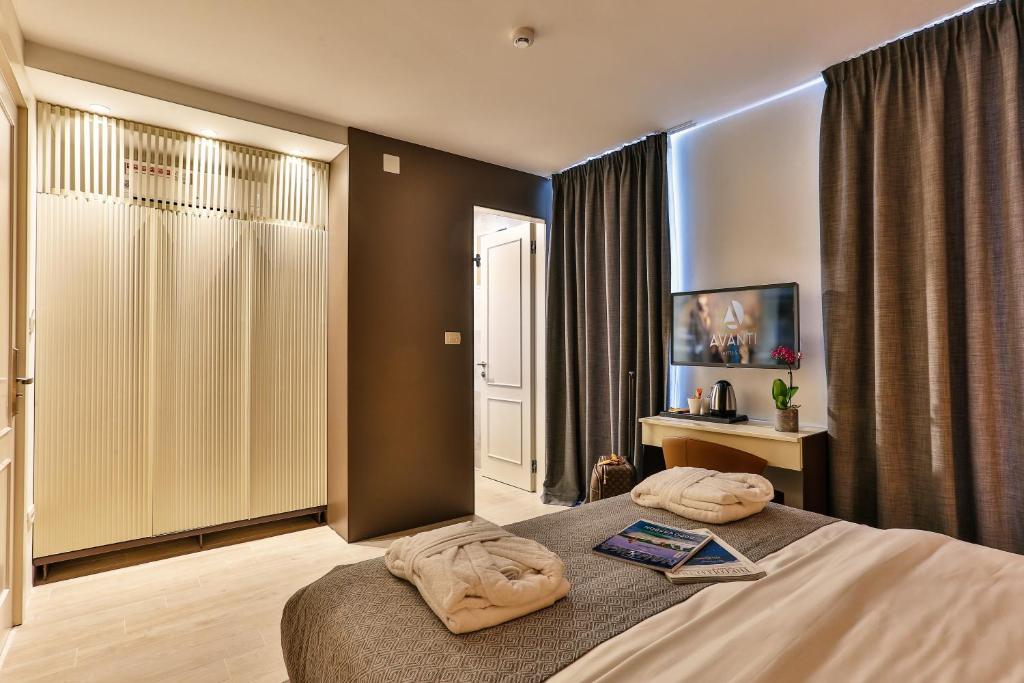 Posteľ alebo postele v izbe v ubytovaní Avanti Hotel & Spa