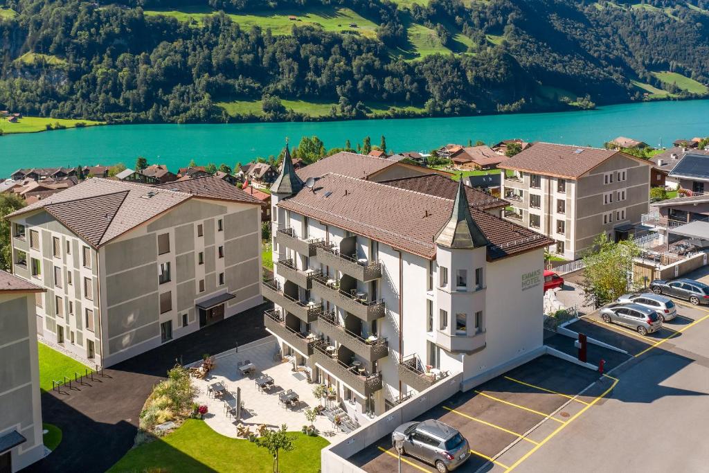 an aerial view of a building with a lake at Emma's B&B - Self Check-in Hotel in Lungern