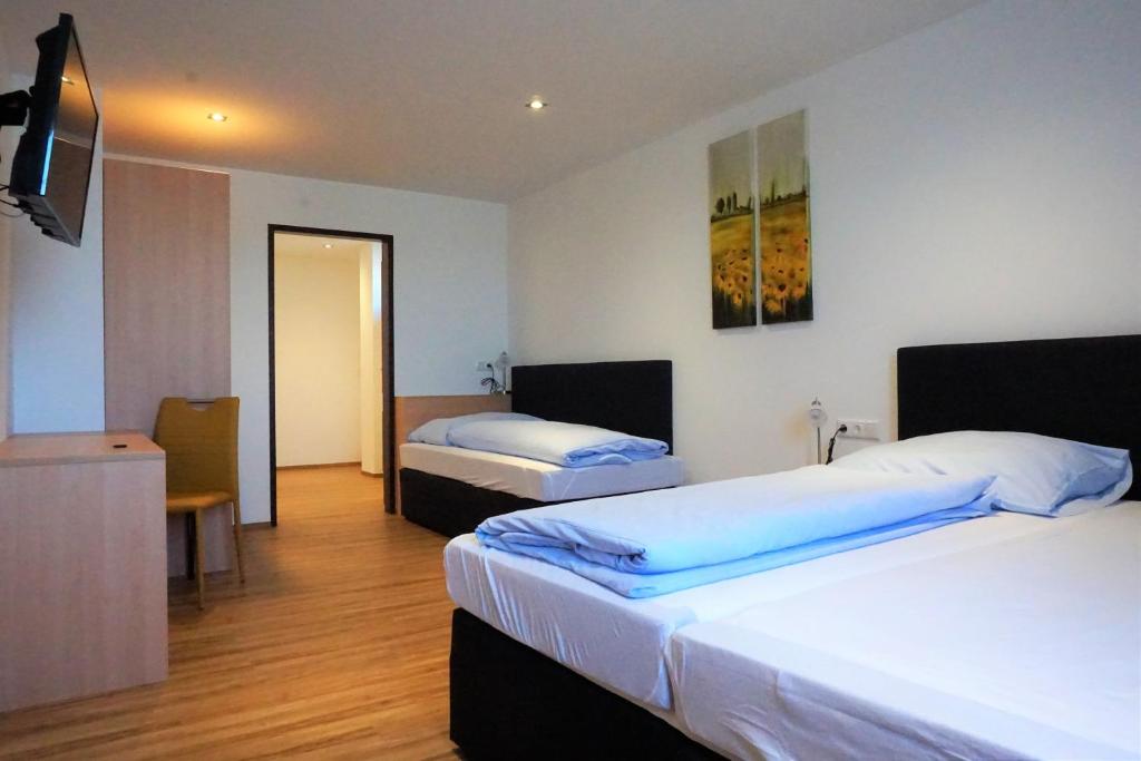 Postel nebo postele na pokoji v ubytování Hotel Wahlmüller