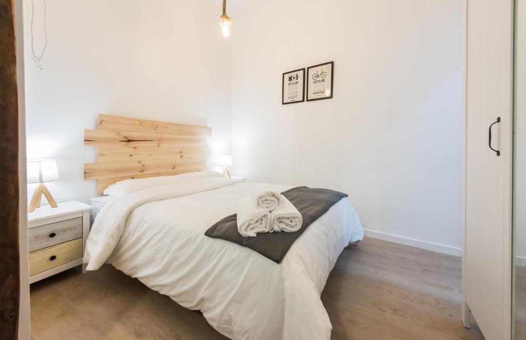 Postel nebo postele na pokoji v ubytování El Encanto de Malasaña
