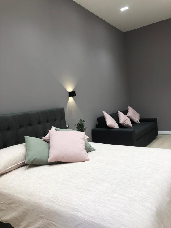 Postel nebo postele na pokoji v ubytování NSH AppartHotel, Napoli Centro