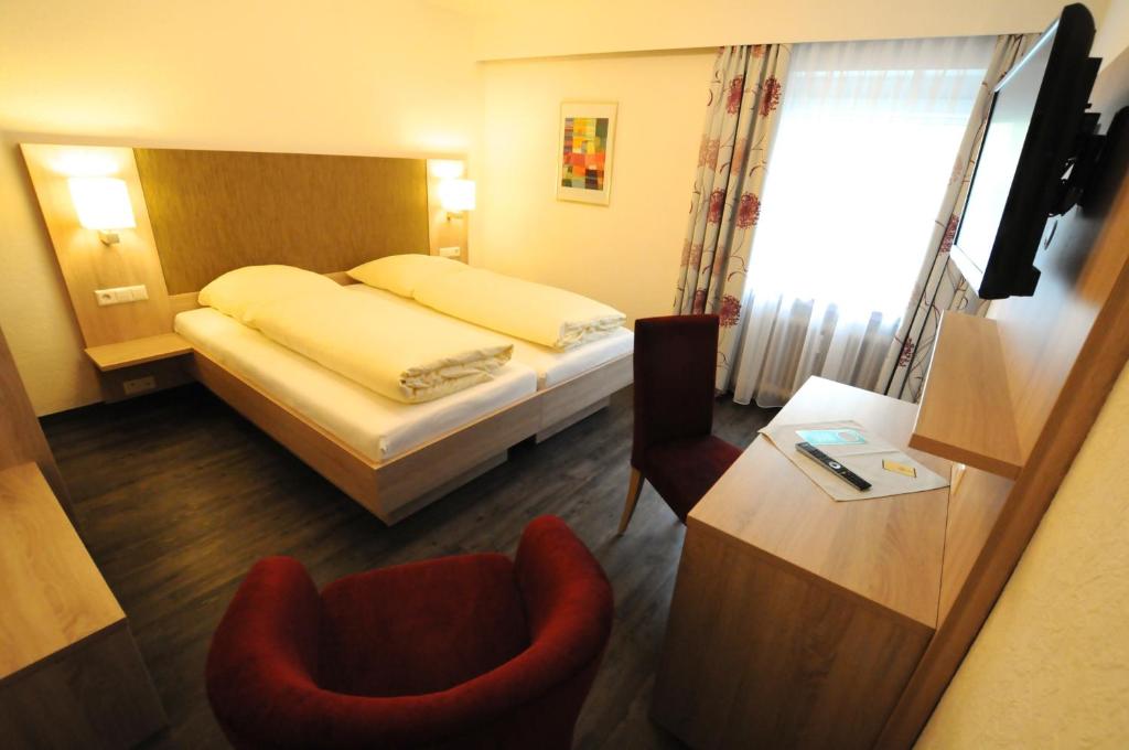 Postel nebo postele na pokoji v ubytování Hotel Ritter