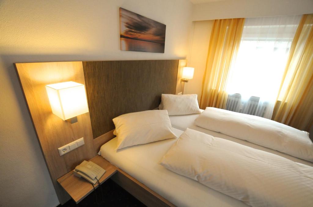 Postel nebo postele na pokoji v ubytování Hotel Ritter