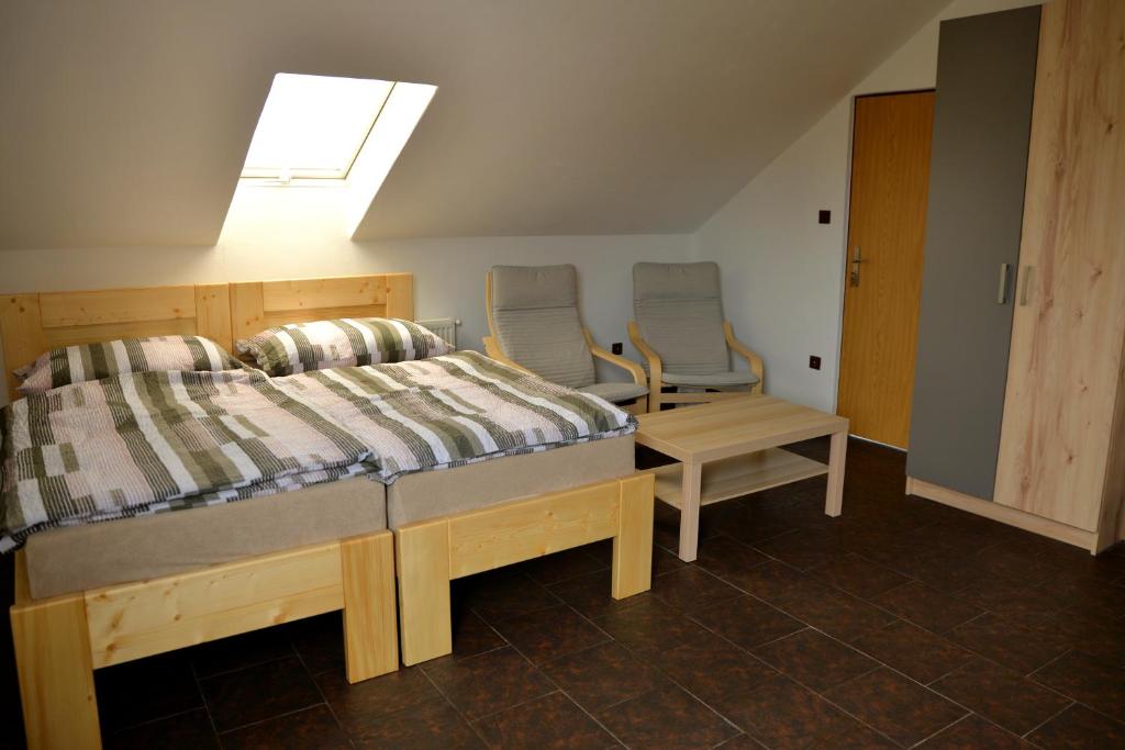 Postel nebo postele na pokoji v ubytování Apartmány u Zdeničky