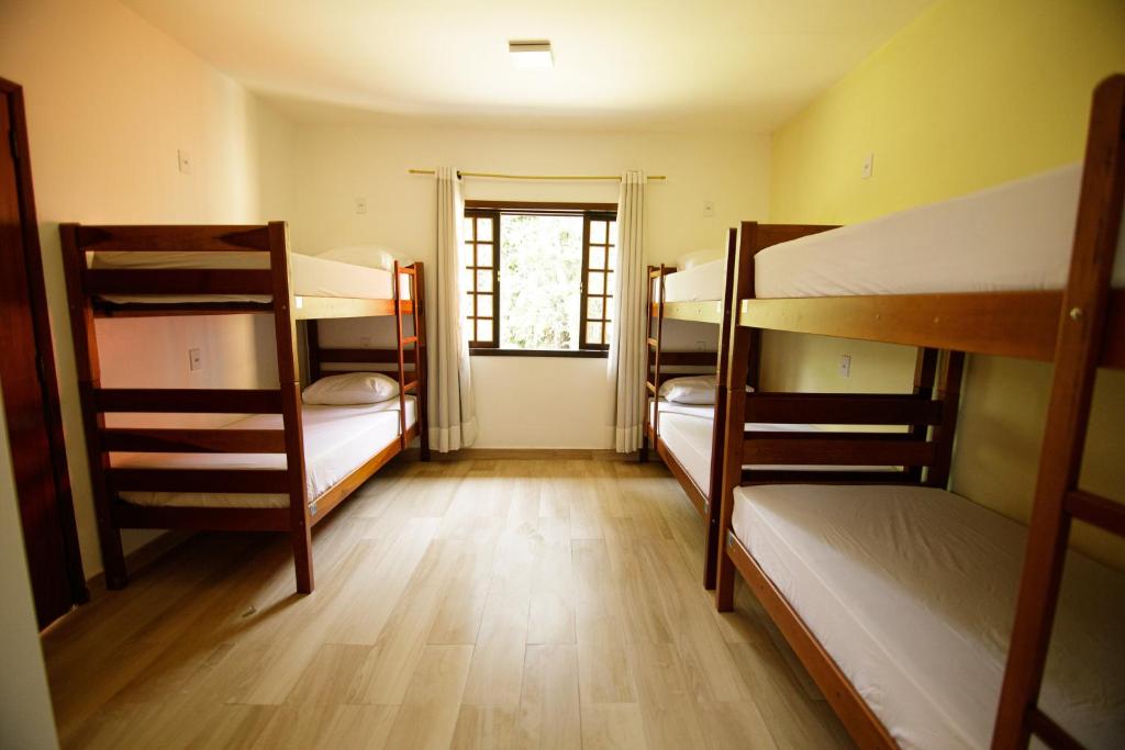 Postel nebo postele na pokoji v ubytování Hostel Refúgio