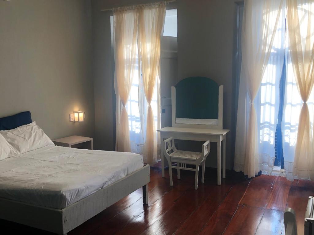 A bed or beds in a room at Casa São Luís