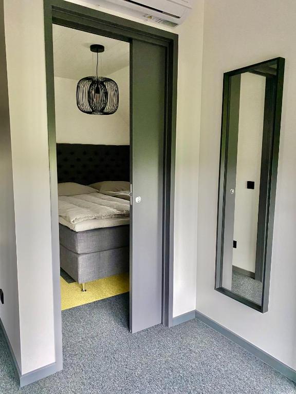 Postel nebo postele na pokoji v ubytování Holstre Paradiis