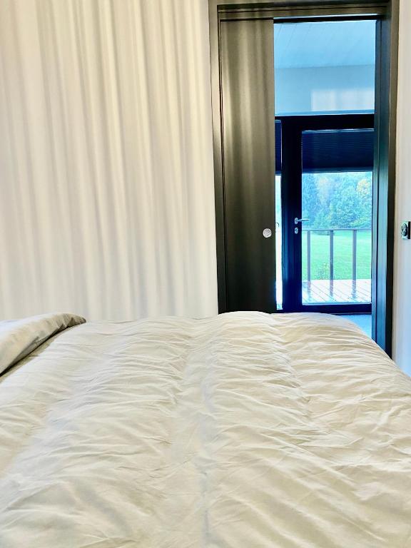 Postel nebo postele na pokoji v ubytování Holstre Paradiis