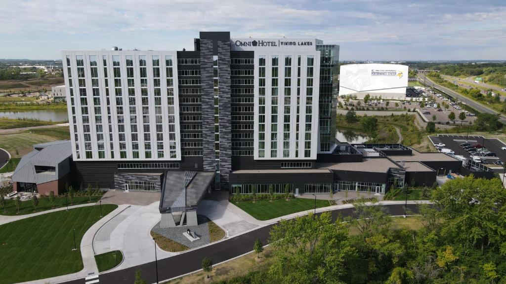 an aerial view of a building with two tall buildings at Omni Viking Lakes in Eagan