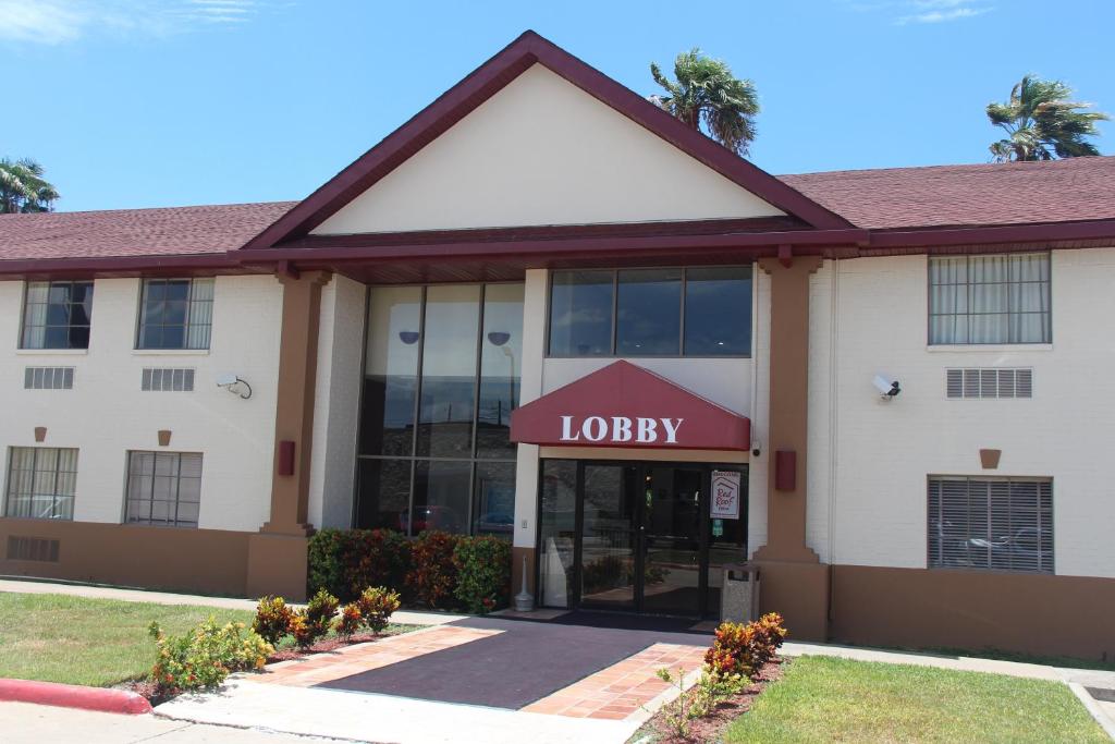 a hotel with a sign that reads loyalty at Red Roof Inn Pharr - McAllen in Pharr