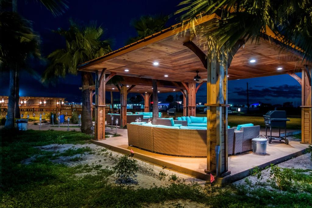 a pavilion on the beach at night at Ocean's Edge Hotel, Port Aransas,TX in Port Aransas