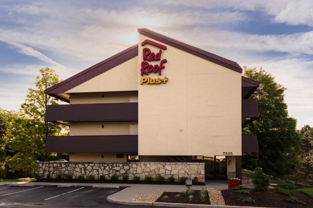 a building with a bud light plus sign on it at Red Roof Inn PLUS+ Chicago - Willowbrook in Willowbrook