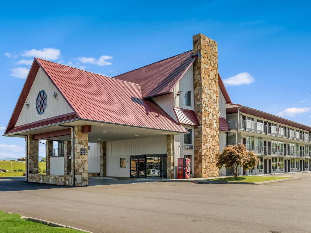 a large building with a red roof at Red Roof Inn Dandridge in Dandridge