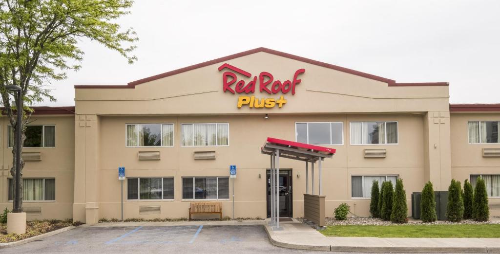 a red roof plus building with a gas station at Red Roof Inn PLUS+ Poughkeepsie in Poughkeepsie