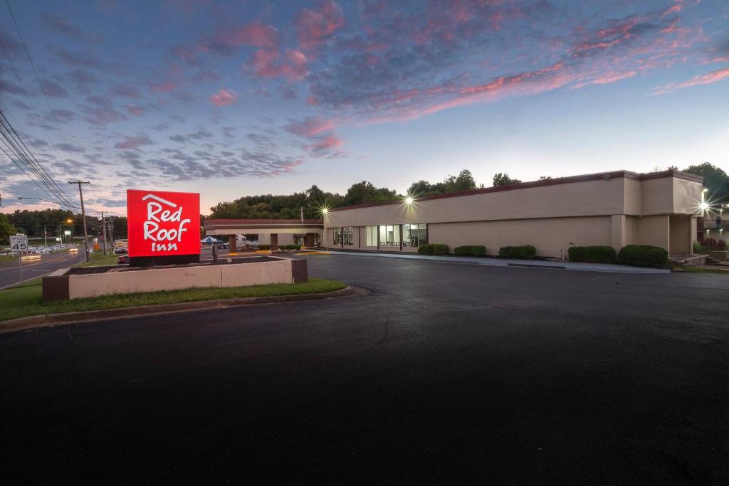 a red sign in front of a building at Red Roof Inn Murray in Murray