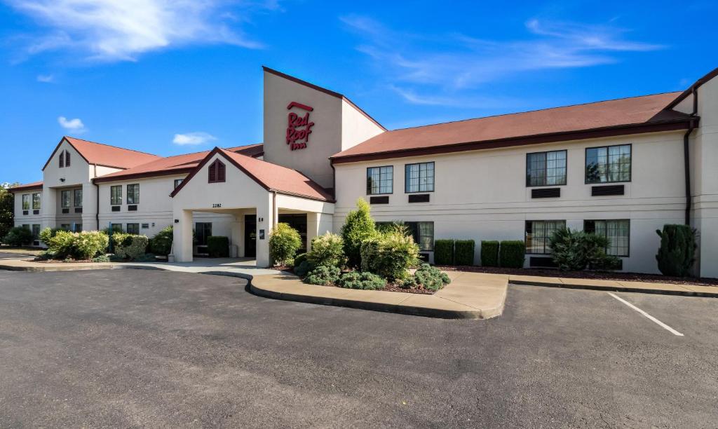 a large white building with a red roof at Red Roof Inn Murfreesboro in Murfreesboro