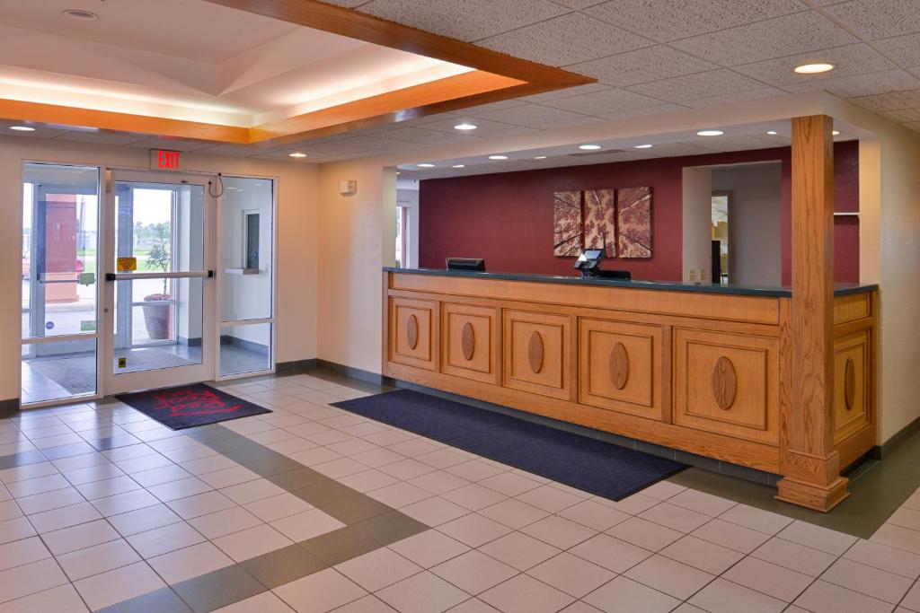 a lobby with a reception desk in a hospital at Red Roof Inn Clyde in Clyde