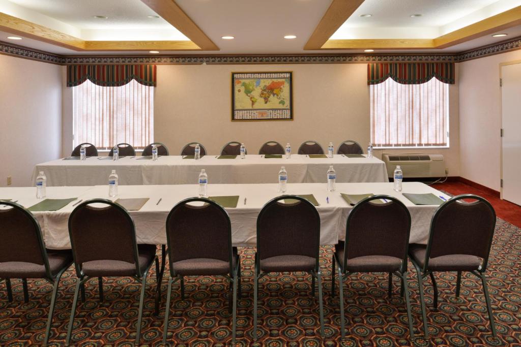 a conference room with a large table and chairs at Red Roof Inn Clyde in Clyde