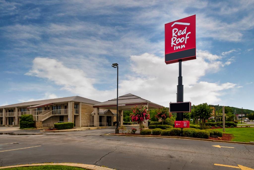 a red roof inn sign in front of a building at Red Roof Inn Gadsden in Gadsden