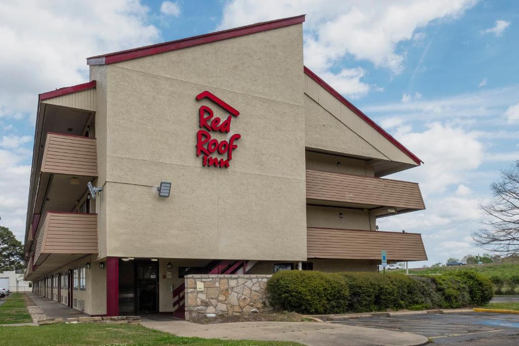 a building with a red rock music sign on it at Red Roof Inn Jackson Downtown - Fairgrounds in Jackson